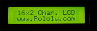 16×2 black-on-green character LCD with backlight in the dark.