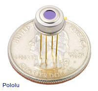 MLX90614 temperature sensor with quarter for size reference.