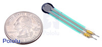 Force-sensing resistor (0.2" circle) with US quarter for size reference.