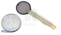 Force-sensing resistor (0.5" circle) with US quarter for size reference.