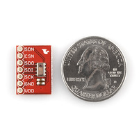 MPL115A1 barometric pressure sensor breakout board, top view with U.S. quarter for size reference.