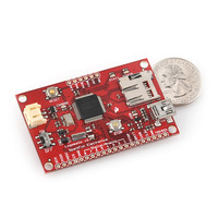 Logomatic v2 serial SD datalogger with U.S. quarter for size reference.