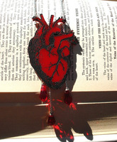 Laser-cut and laser-engraved necklace with painted engraving.