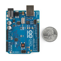 Arduino Uno SMD edition, top view, with U.S. quarter for size reference.