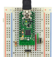Wixel on breadboard with a bootloader button and reset button connected.