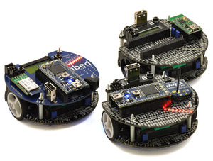 Fleet of m3pi robots: ARM’s original m3pi (left) and Pololu’s m3pis (right).