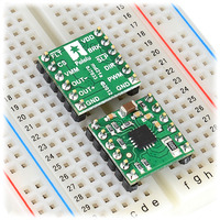 DRV8801 single brushed DC motor driver carriers inserted into a solderless breadboard.