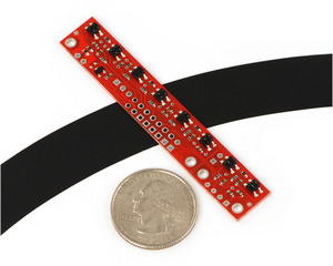 QTR-8A reflectance sensor array on a 3/4" line with a quarter for size reference.